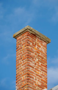 masonry chimney with blue sky background